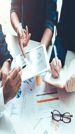 People looking at statistical graphs and discussing them